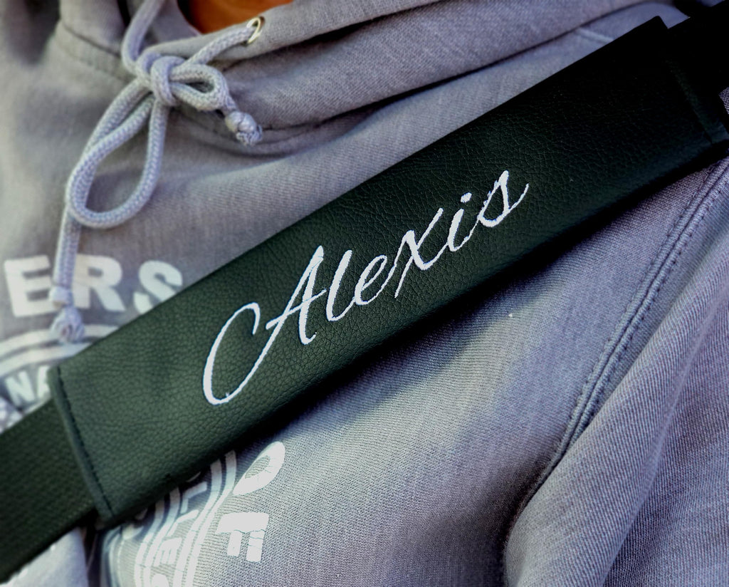 Personalized embroidered faux leather seat belt cover pad installed in SUV seat belt